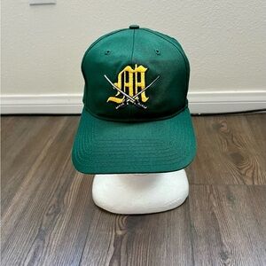 Green Baseball Cap with Yellow Logo